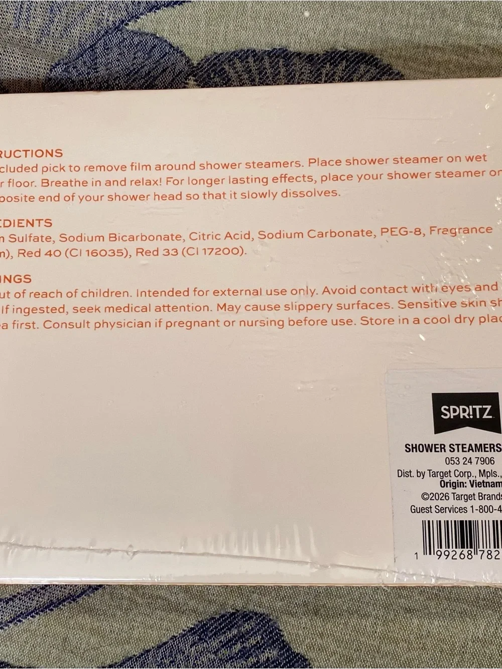 Spritz Shower Steamers in Pink and Orange Packaging